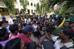 Sangakkara is photographed by adoring young fans in Jaffna