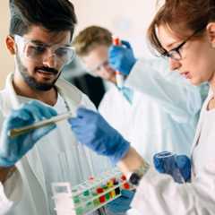 Young students of chemistry working together in laboratory