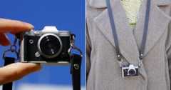 A miniature camera is shown in two scenes: held between fingers against a blue sky, and worn as a necklace over a brown coat.