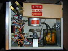 The exposed interior of a 1980s microwave oven