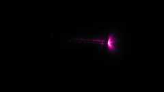 Photograph of corona discharge from a wire taken in a dark room.
