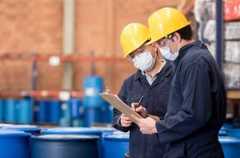 Workers wearing hard hats and protective gear