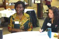 Yaa Klu, teaching faculty in the Department of Food Science, speaks to a group seated at a round table as Amy Holevas, an instructional design supervisor in CTLM, takes notes during a CTLM workshop.