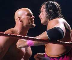Steve Austin and Bret Hart in each others faces in the ring