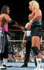 Bret Hart and 'Mr Perfect' Curt Hennig shaking hands in the ring