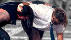 Undertaker and Mick Foley battle it out atop the Hell in a Cell moments before all hell breaks loose.