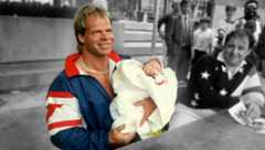 Lex Luger holding a baby during the height of the Lex Express tour because why not?