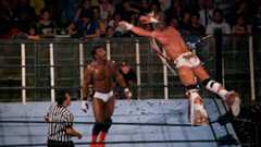 The Ultimate Warrior glides in the air towards his opponent, Orlando Jordan, in what would be Warrior's final-ever match. Nu Wrestling Evolution, Barcelona, Spain, June 25, 2008.