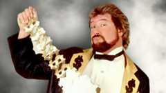 Ted DiBiase showing off his Million Dollar Championship belt. [Photo courtesy of WWE.com]