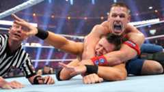 John Cena grapples The Miz for the WWE Championship at WrestleMania XXVII – the match overshadowed by The Rock’s post-bell ambush. 