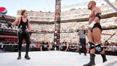 Sting confronts Triple H in a nostalgia-laden WrestleMania 31 showdown featuring DX versus nWo interference before a sledgehammer finish. 