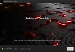 Window with AMD arrow logo, futuristic background and completion notice