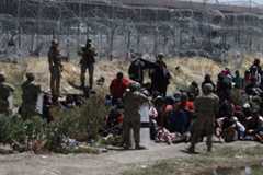 U.S. security forces prevent migrants coming to the border from crossing into the U.S. in April 2024.