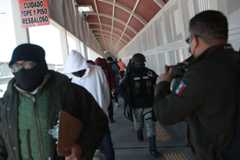A group of 80 Mexicans are deported from the United States on Thursday through Ciudad Juarez via the Paso del Norte international bridge.