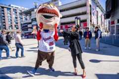 Corinna Delgado of DC News Now interviews “Teddy Roosevelt,” one of the Washington Nationals’ “Racing Presidents” mascots, during media preview day at Nationals Park on  March 21. (Tom Williams/CQ Roll Call)