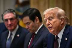 Interior Secretary Doug Burgum (far left) and Secretary of State Marco Rubio (left) look on as President Donald Trump speaks during a Cabinet meeting at the White House on Tuesday. (Mandel Ngan/AFP via Getty Images)