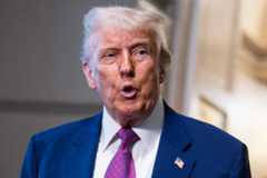 President Donald Trump talks with reporters after a House Republican Conference meeting in the Capitol on May 20.