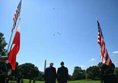 President Donald Trump and Polish President Karol Nawrocki watch a flyover of F-16 aircraft in the "missing man" formation from the South Lawn of the White House on Wednesday. (Saul Loeb/AFP via Getty Images)