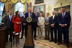 President Donald Trump, flanked by members of Alabama's congressional delegation and others, speaks to reporters in the Oval Office on Tuesday as he announces the moving of Space Command headquarters from Colorado to Alabama. (Alex Wong/Getty Images)
