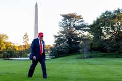 President Donald Trump walks to the White House after stepping off Marine One on Sunday.