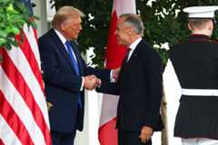 President Donald Trump welcomes Canadian Prime Minister Mark Carney outside the West Wing of the White House on Tuesday.