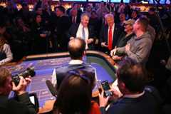 President Donald Trump visits with patrons at a craps table at Circa Resort and Casino in Las Vegas on Jan. 25.