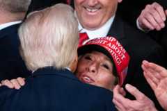 President Donald Trump greets Georgia Rep. Marjorie Taylor Greene in the House chamber on March 4 after addressing a joint session of Congress. (Tom Williams/CQ Roll Call)