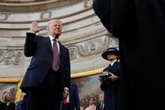 Donald Trump is sworn in as president by Chief Justice John G. Roberts Jr. in the Capitol Rotunda on Jan. 20 as first lady Melania Trump looks on.