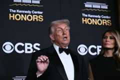 President Donald Trump and first lady Melania Trump arrive at the Kennedy Center in Washington on Sunday.