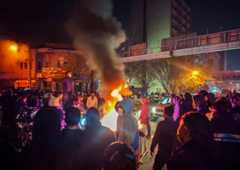 Fires are lit as protesters rally against the Iranian government in Tehran on Jan. 8. (Anonymous/Getty Images)
