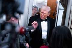 President Donald Trump speaks to reporters Saturday aboard Air Force One after attending the Alfalfa Club's annual dinner in Washington.