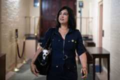 Rep. Nicole Malliotakis, R-N.Y., and her dog, Luna, leave a meeting of the House Republican Conference in June. 