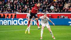 Schick hits four as Leverkusen close gap to Bayern on sombre weekend