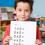 数学で、普通思いつかないような式を持ち出したりするときに、「天下り的に」という言葉を使いますが、英語に訳するとどうなりますか?