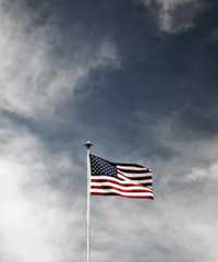 An American flag on a cloudy day.