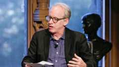 Paul Elie speaks at an event.