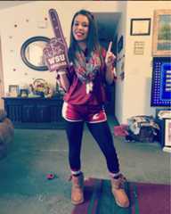 A WSU fan with a #1 WSU Cougar foam finger. 