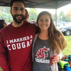 A husband and wife dressed with WSU cougar gear. 