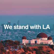 We stand with LA. Image of the Los Angeles skyline with the Griffith Observatory in the foreground.