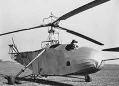 Igor Sikorsky in the VS-300A. Note the small passenger seat added directly in front of the transmission.