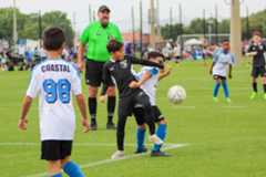 Referee officiating a soccer game