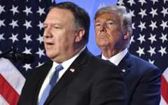 US President Donald Trump, right, listens to US Secretary of State Mike Pompeo during a press conference after a summit of heads of state and government at NATO headquarters in Brussels, Belgium, July 12, 2018. (Geert Vanden Wijngaert/AP)