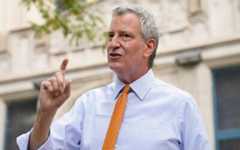New York Mayor Bill de Blasio speaks to reporters after visiting New Bridges Elementary School in the Brooklyn borough of New York to observe pandemic-related safety procedures, August 19, 2020. (AP Photo/John Minchillo, File)
