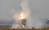 File: An Iron Dome anti-missile system fires an interceptor missile as rockets are fired from the Gaza Strip at Israel, August 6, 2022. (Yonatan Sindel/Flash90)
