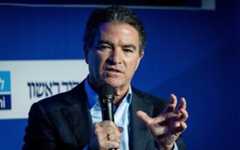 Former Mossad chief Yossi Cohen speaks at a conference of the Makor Rishon newspaper at the International Convention Center in Jerusalem, February 21, 2022. (Yonatan Sindel/ Flash90/ File)