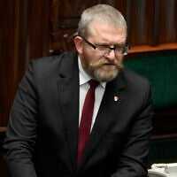Far-right Polish lawmaker Grzegorz Braun speaks to parliament in Warsaw, Poland, on December 11, 2023. (AP Photo/ Czarek Sokolowski)
