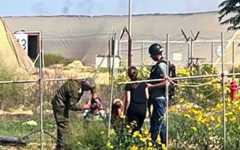 Nasreen Youssef filmed talking to Hamas terrorists near the yard of her home on Moshav Yated, close to the southern Gaza border, October 7, 2023. (Screenshot taken from Channel 12/Keshet TV, used in accordance with Clause 27a of the Copyright Law).