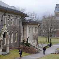 People walk on the campus of Cornell University in Ithaca, New York, February 2, 2024. (AP Photo/Seth Wenig)