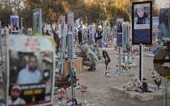 People visit the site of the Nova music festival, where hundreds of revelers were killed and abducted by Hamas and taken into Gaza, as Israel marks the second year anniversary of the attack, near Kibbutz Reim, southern Israel, Oct. 7, 2025. (AP Photo/Ariel Schalit)