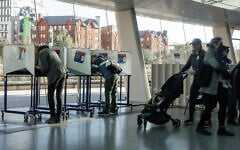 People cast their ballots during early voting, October 25, 2025, in New York. (AP Photo/Olga Fedorova)